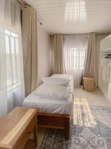 Postel nebo postele na pokoji v ubytování Meanwood Ndeke Lusaka Airport Apartments by Cozy Stead