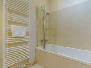 a bathroom with a glass shower and a tub at 2 Bed in Thirsk 48116 in Carthorpe +15 photos