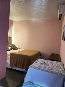 En eller flere senge i et værelse på Pousada - Casa dos Paiva