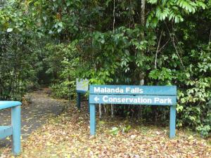 a sign for the maligne falls conservation park at Malanda Falls Retreat in Malanda