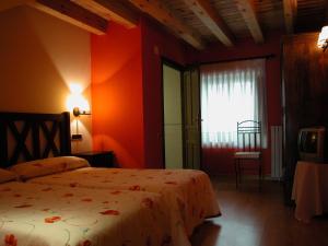 a hotel room with two beds and a window at C.T.R. Camino de la Fuentona in Cabrejas del Pinar