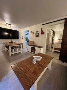 a living room with a table and a bed at Powder and Paddle in McCall