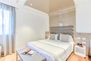Postel nebo postele na pokoji v ubytování Mh Florence Hotel & Spa