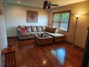 a living room with a couch and a table at Pointer Palace in South Point