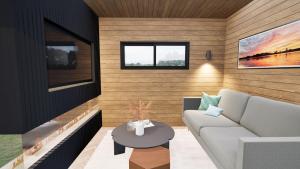 un soggiorno con un divano e un tavolo di Staining Luxury Lodges a Poulton-le-Fylde
