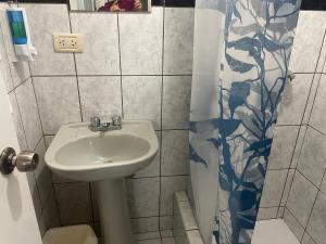 a bathroom with a sink and a shower at Miraflores Moonlight in Lima +10 photos