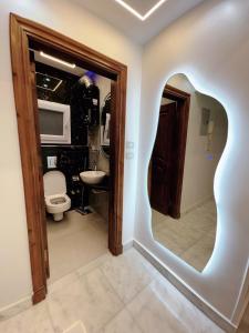 a bathroom with a toilet and a sink at Luxury three bedroom duplexSheraton Airport in Cairo +23 photos