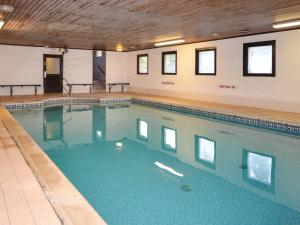 a large swimming pool in a building at 3 Bed in Crediton WAIE2 in Zeal Monachorum