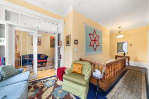 a living room with a couch and a chair at Loyalist Lofts in Picton