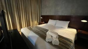 Кровать или кровати в номере FlatScape 1113 - Flat Aconchegante na Chácara Santo Antônio - Verbo Divino