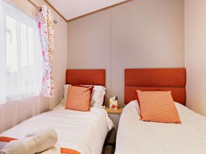 a room with two beds and a window at 2 Bed in St Andrews 90764 in St. Andrews
