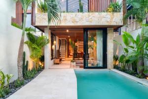 an external view of a house with a swimming pool at Blacksand Villas Bingin, Uluwatu by Sandara in Uluwatu +118 photos