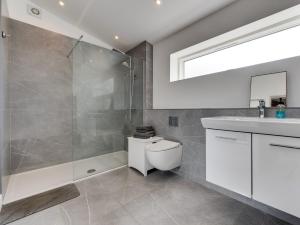 a bathroom with a shower and a toilet and a sink at 1 Bed in Stokesley 86813 in Great Broughton +51 photos