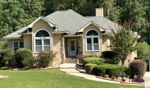 a small house with a lawn in front of it at Hibiscus Retreat fully equipped guest studio in Fayetteville