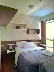 Ένα ή περισσότερα κρεβάτια σε δωμάτιο στο FLAT 313 S4 Hotel
