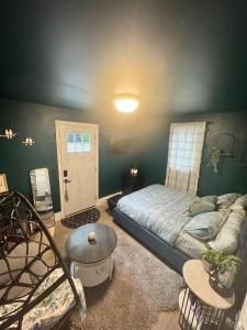 a bedroom with a bed and a room with a window at Dream room in Moncton