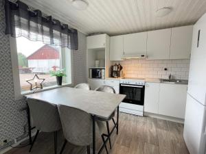 a kitchen with a table and chairs in a room at Nature Retreat on Farm in Berga in Berga