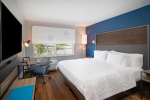 Ένα ή περισσότερα κρεβάτια σε δωμάτιο στο Tru By Hilton Savannah Airport +16 φωτογραφίες