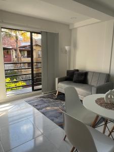 Χώρος καθιστικού στο Apartamento en la América