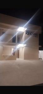 a building with a light on the side of it at Hotel Içana in São Gabriel da Cachoeira