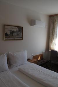 Postel nebo postele na pokoji v ubytování Pension Casa Topolino