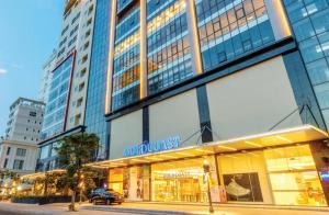 a store front of a building on a city street at Gold Coast Apartment Nha Trang in Nha Trang