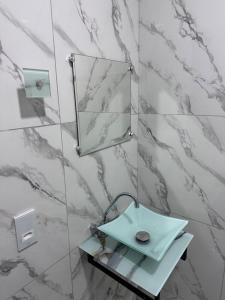 a bathroom with a sink and a mirror at House in Itacaré in Itacaré +26 photos