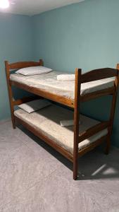 a wooden bunk bed with two mattresses on it at House in Itacaré in Itacaré +26 photos