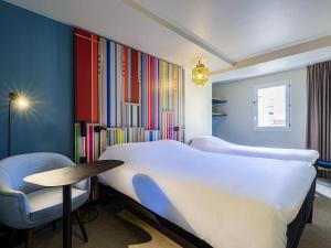 Postel nebo postele na pokoji v ubytování ibis Styles Perpignan Centre Gare