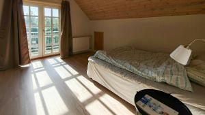 a bedroom with a bed and a large window at Renovated Farmhouse With Starry Sky Views in Barrit +8 photos