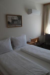 Postel nebo postele na pokoji v ubytování Pension Casa Topolino