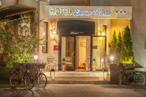 two bikes parked in front of a hotel gamma morgue at Hotel Santa Maria in Saint-Florent