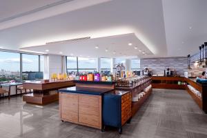 a restaurant with a view of a city at Ascott Raffles City Chengdu in Chengdu