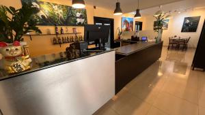 a bar in a restaurant with a counter top at Caonabo35 Santo Domingo 201 in Santo Domingo
