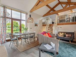 a living room with a table and chairs at 2 Bed in Hay-on-wye 42881 in Craswall