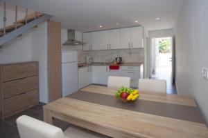 Kuchyňa alebo kuchynka v ubytovaní Mar e Sol Apartments