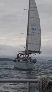 a sail boat in the ocean on the water at Paraty em um veleiro passeio diário in Paraty