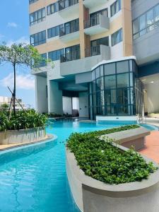 a building with a swimming pool in front of it at Trizen luxury apartments Colombo Sri lanka in Colombo
