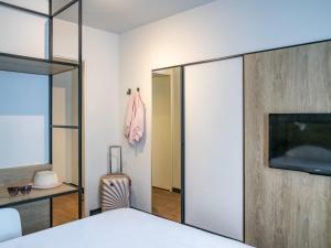 Giường trong phòng chung tại ibis Gap Centre