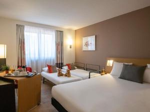 Ένα ή περισσότερα κρεβάτια σε δωμάτιο στο Novotel Nice Centre Vieux Nice +161 φωτογραφίες