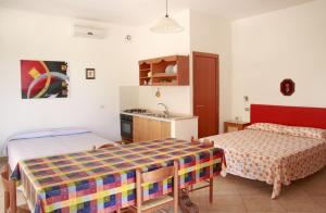 a room with two beds and a sink in it at Villa Giovanna in Nardò