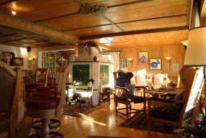 a living room filled with furniture and a fireplace at Stammhaus im Hotel Alpine Palace in Saalbach-Hinterglemm