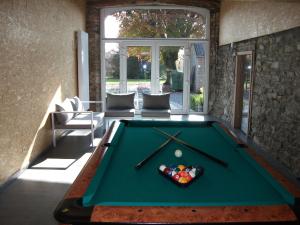 a pool table in the middle of a room at Holiday Home with Sauna in Sourbrodt in Waimes