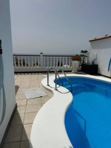 a swimming pool on top of a building at Villa Alexander in Puerto de Santiago