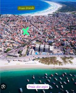 a view of a beach with boats in the water at House in Arraial do Cabo in Arraial do Cabo