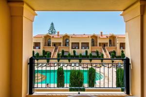 a view from the balcony of a hotel with a swimming pool at Baia da Luz Resort in Luz