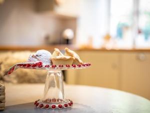 a plate of ice cream on a table at 1 Bed in Blockley 53420 in Blockley +11 photos