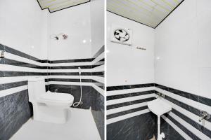 a bathroom with black and white stripes and a toilet at Super Hotel O Krishna Janam Bhoomi Formerly Ashirwad Palace in Mathura