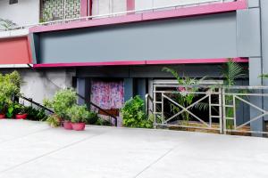 a building with plants in front of it at Super Collection O NIT More Adityapur Formerly Hotel Subheksha in Jamshedpur