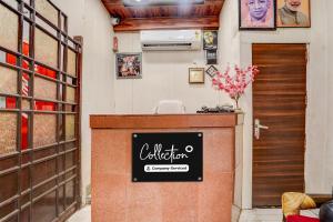 a restaurant with a counter in a room at Collection O Tajganj West Gate Formerly Hotel Host in Tājganj